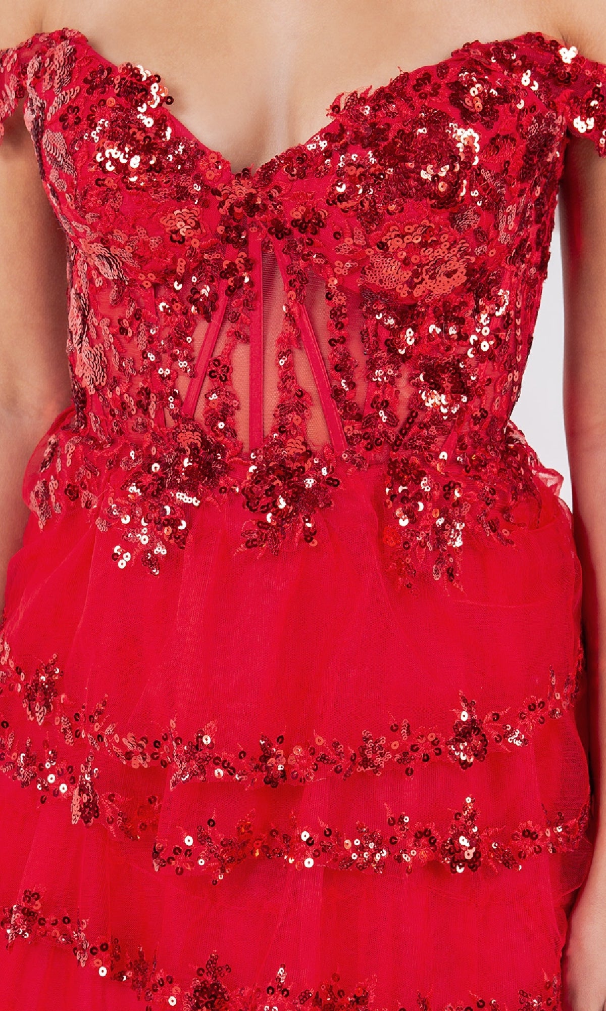 Close-up of a person wearing the Ruffle Prom Ball Gown: Cinderella Couture 8228J, a red off-the-shoulder dress with sequin embroidery, floral details, and sheer mesh panels.